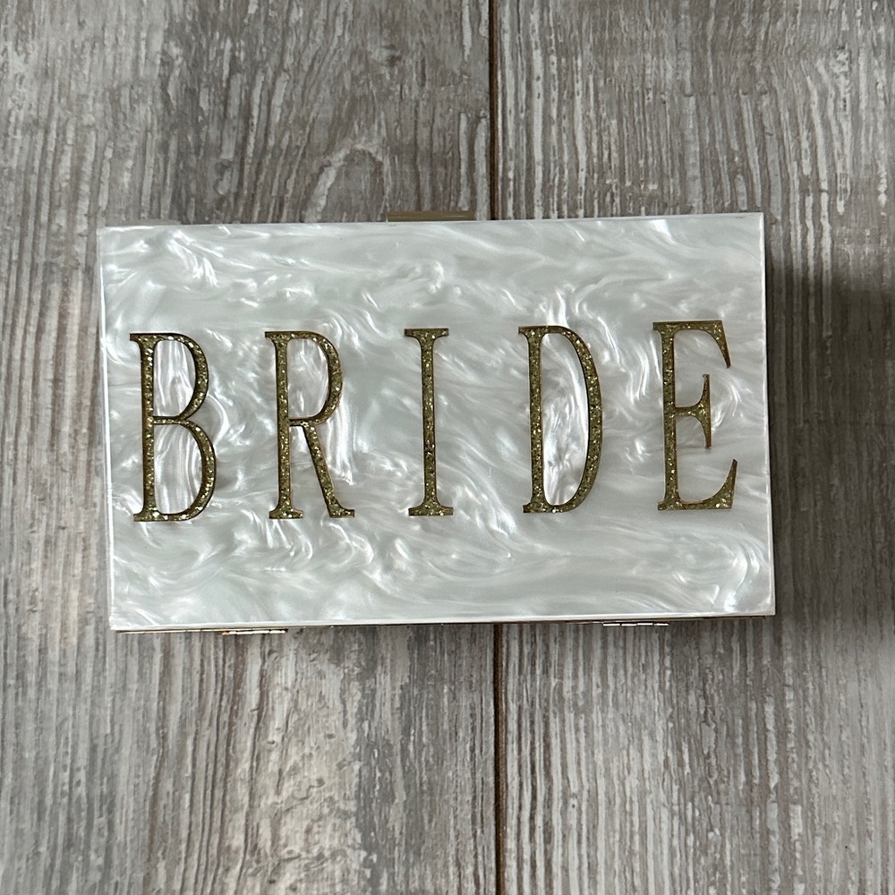 USED ONCE BRIDE ACRYLIC PURSE.